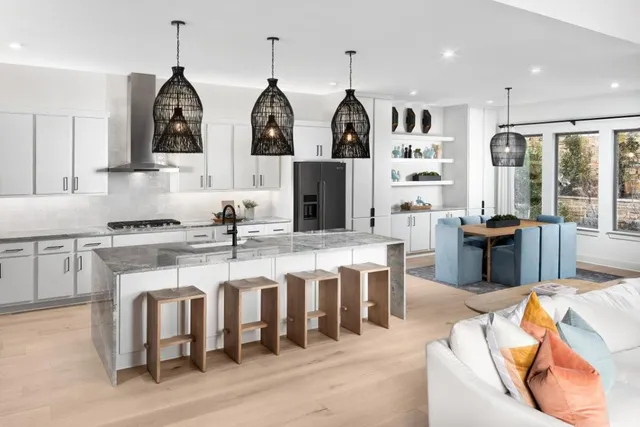 a large kitchen with lots of counter space and windows