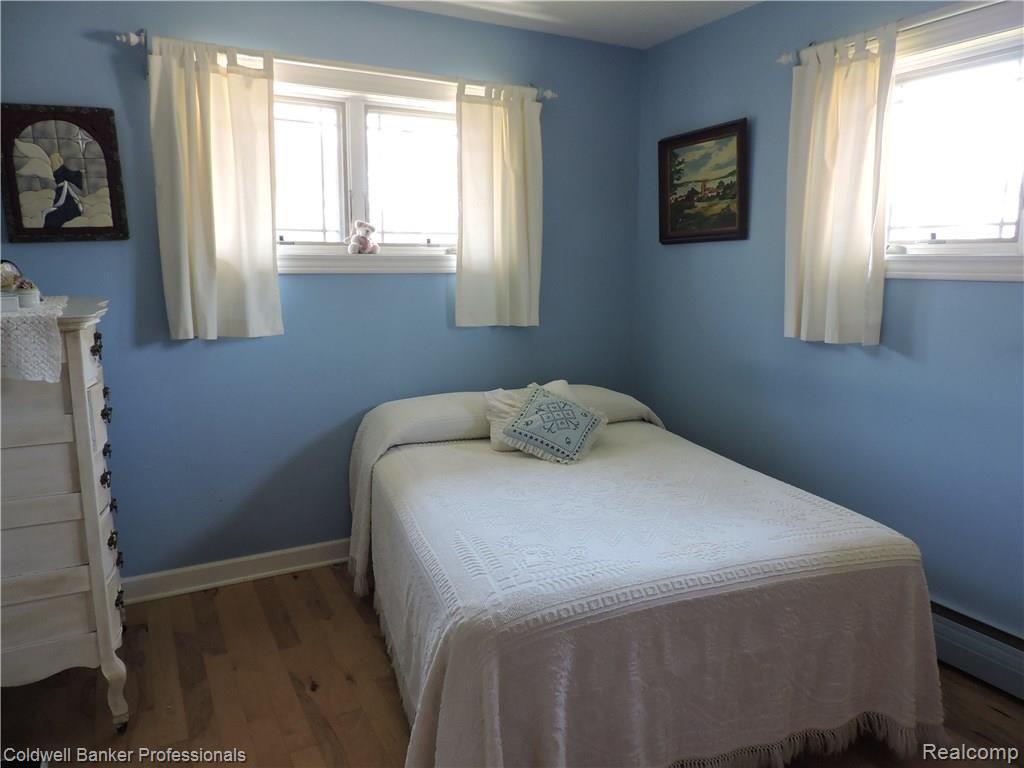 9428 Sashabaw Road Clarkston, MI 48348 - Photo 16 of 19 Master bedroom full of light.