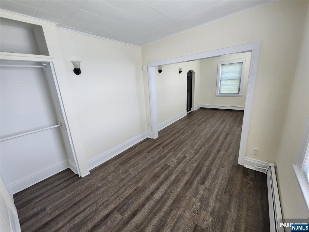 432 Broad Avenue Ridgefield, NJ 07657 - Photo 5 of 8 a view of an empty room with wooden floor and a window