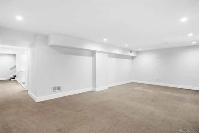 an empty room with a empty space and a window