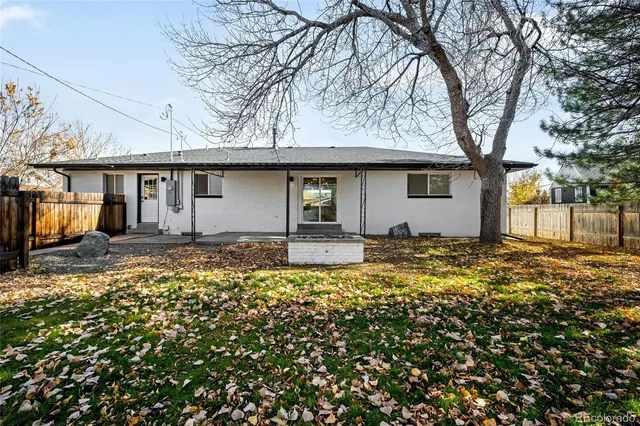 a yellow house with a outdoor space