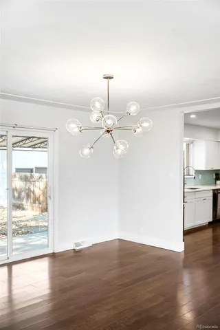a kitchen with stainless steel appliances a refrigerator sink and microwave