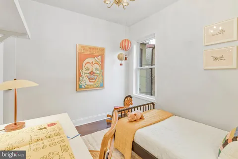 a bedroom with a bed and a table