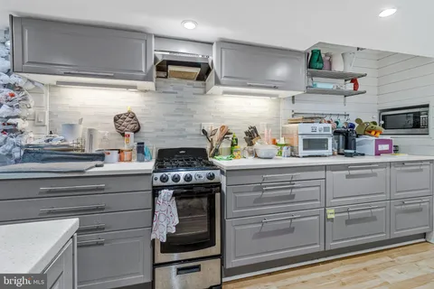 a kitchen with appliances cabinets and a sink