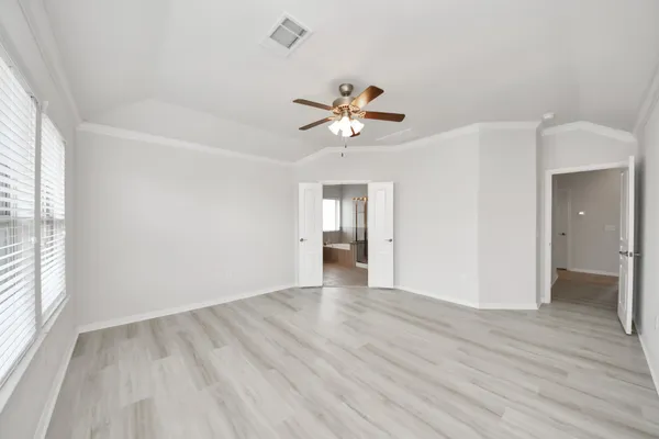 a spacious bathroom with a double vanity sink mirror and shower