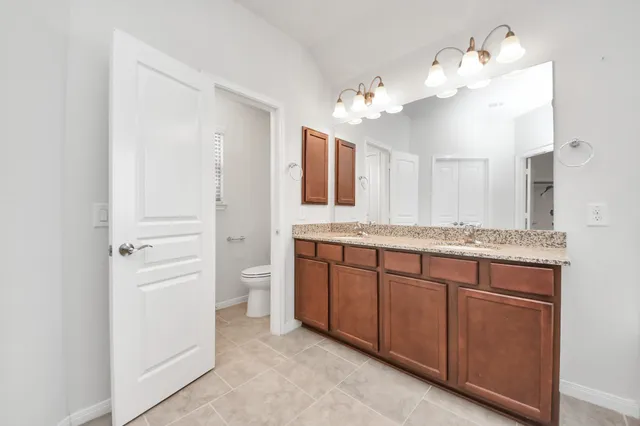 a view of a backyard with plants and a garden