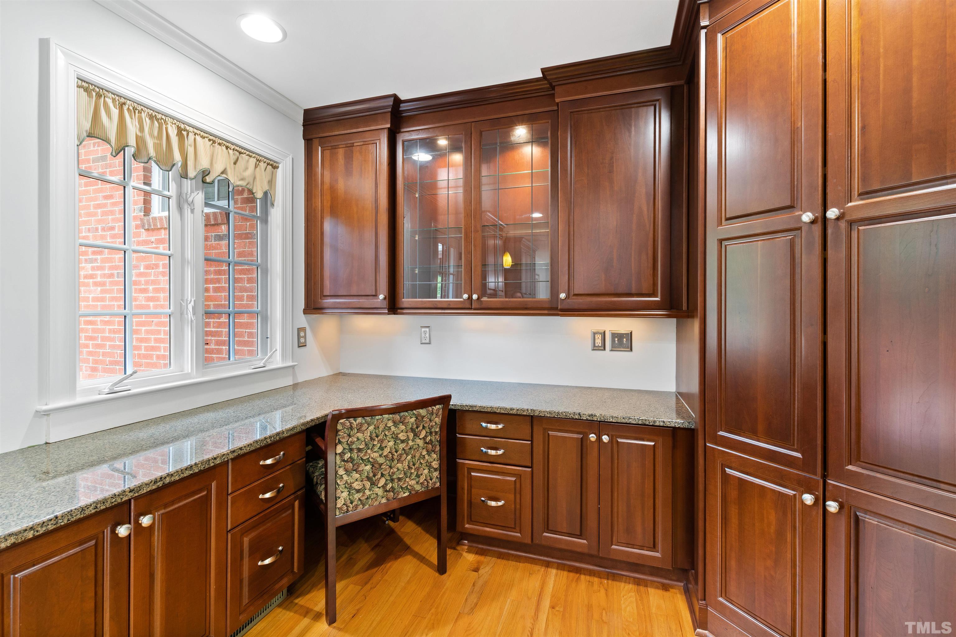1320 Diehl Street Raleigh, NC 27608 - Photo 15 of 47 a kitchen with stainless steel appliances granite countertop a refrigerator and a sink