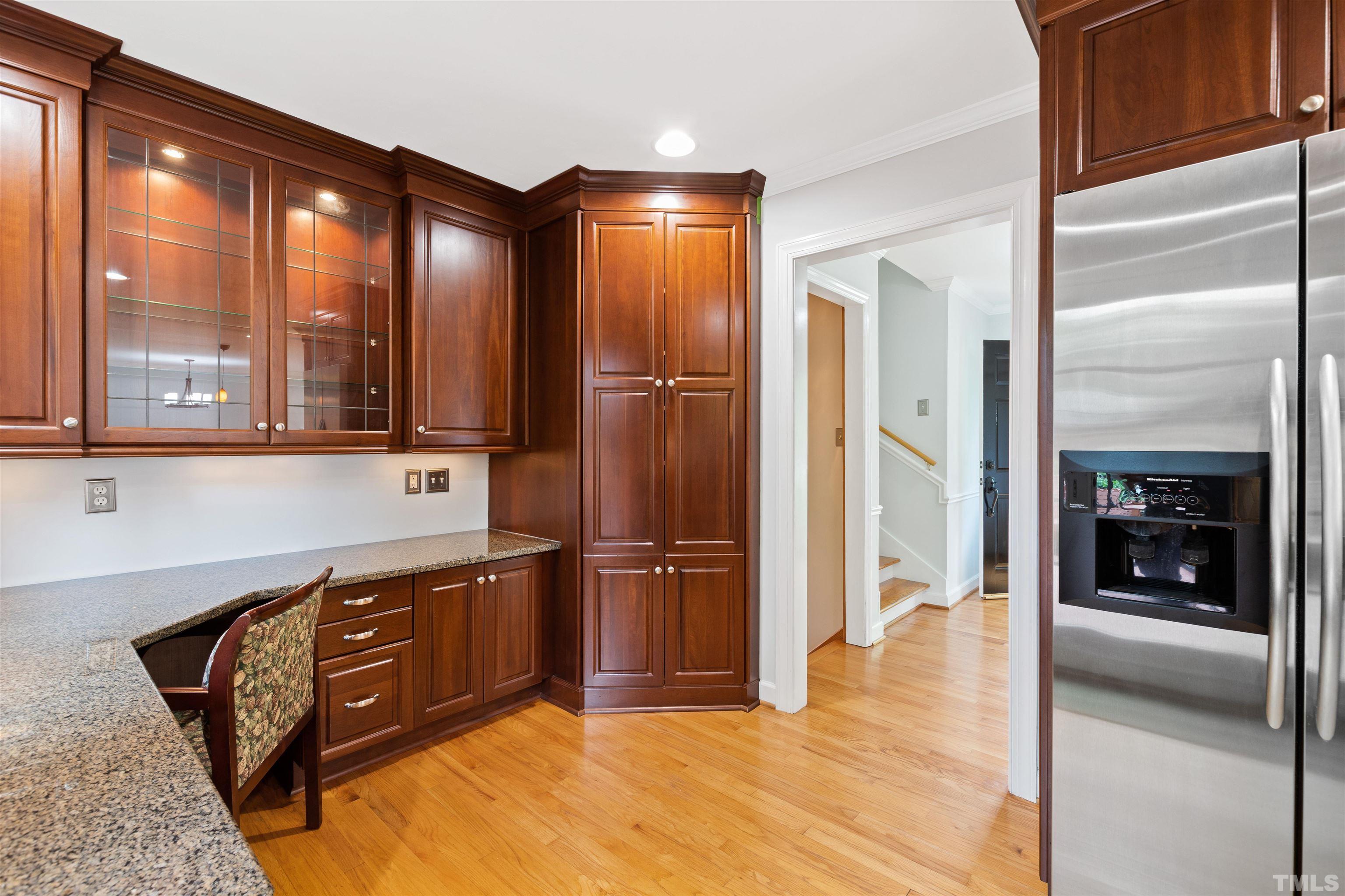 1320 Diehl Street Raleigh, NC 27608 - Photo 16 of 47 a kitchen with stainless steel appliances granite countertop a refrigerator and a sink