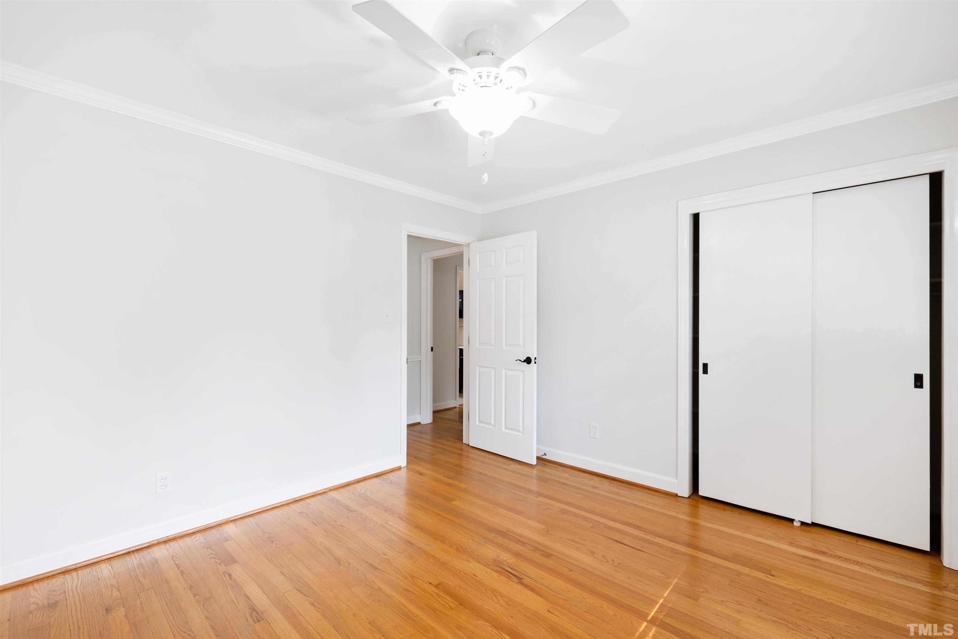 1320 Diehl Street Raleigh, NC 27608 - Photo 23 of 47 a view of an empty room with wooden floor