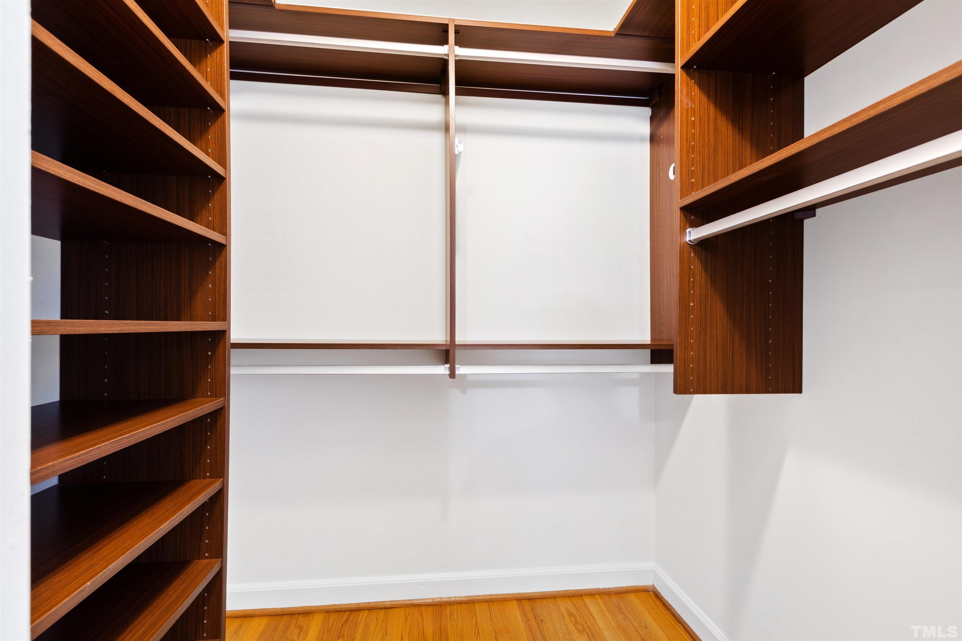 1320 Diehl Street Raleigh, NC 27608 - Photo 28 of 47 a view of walk in closet with clothes and shoes