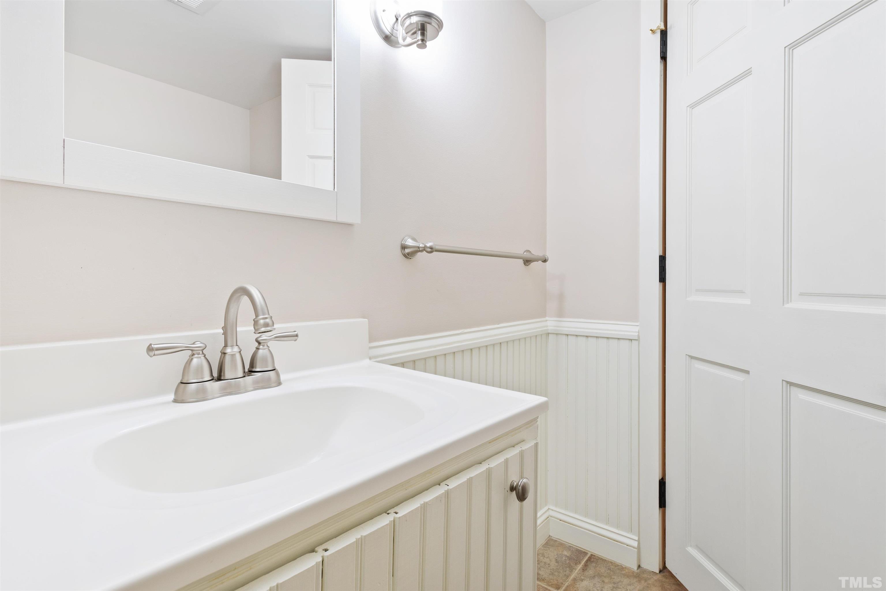 1320 Diehl Street Raleigh, NC 27608 - Photo 33 of 47 a bathroom with a sink and vanity