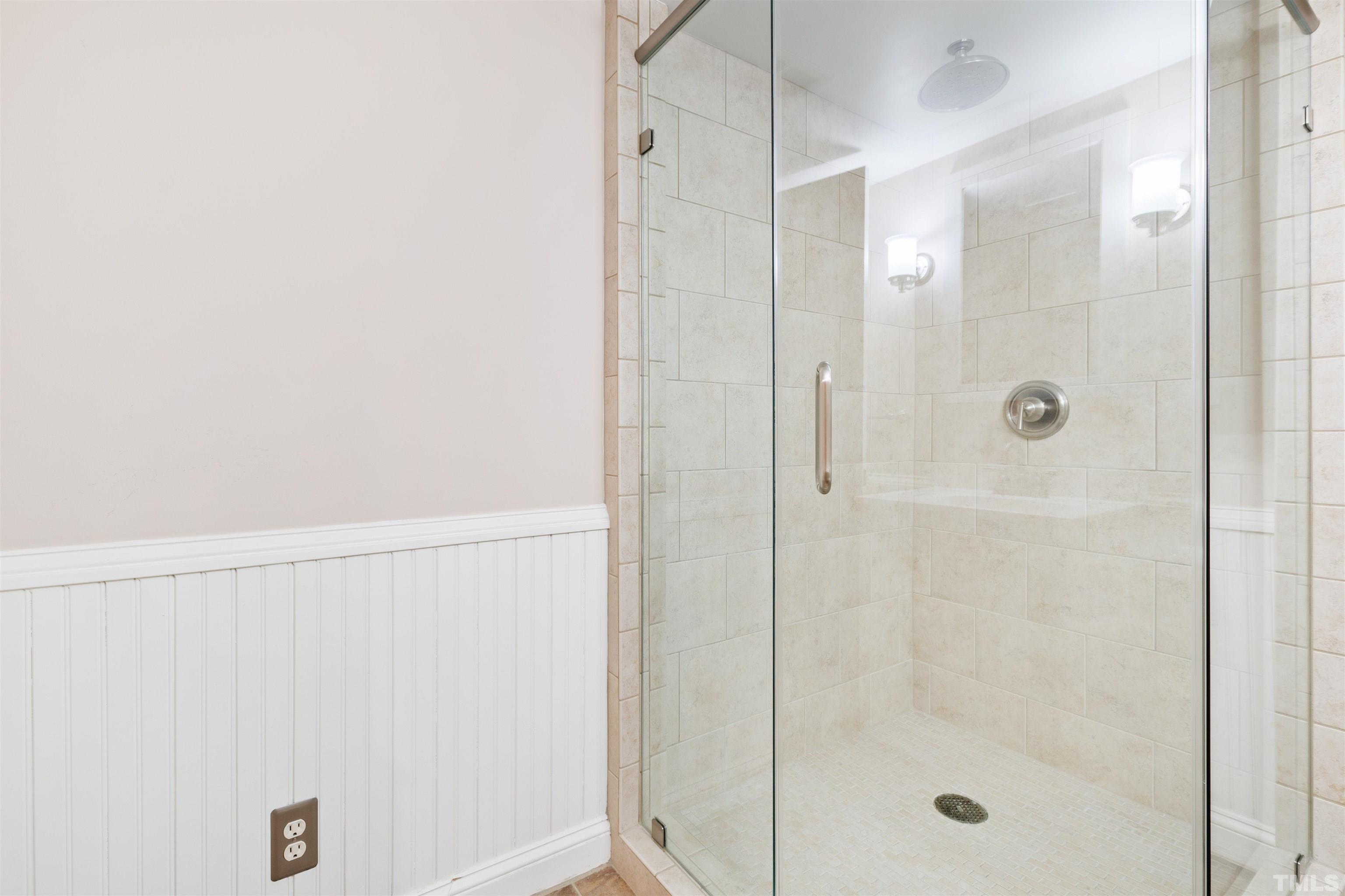 1320 Diehl Street Raleigh, NC 27608 - Photo 34 of 47 a bathroom with a glass shower door