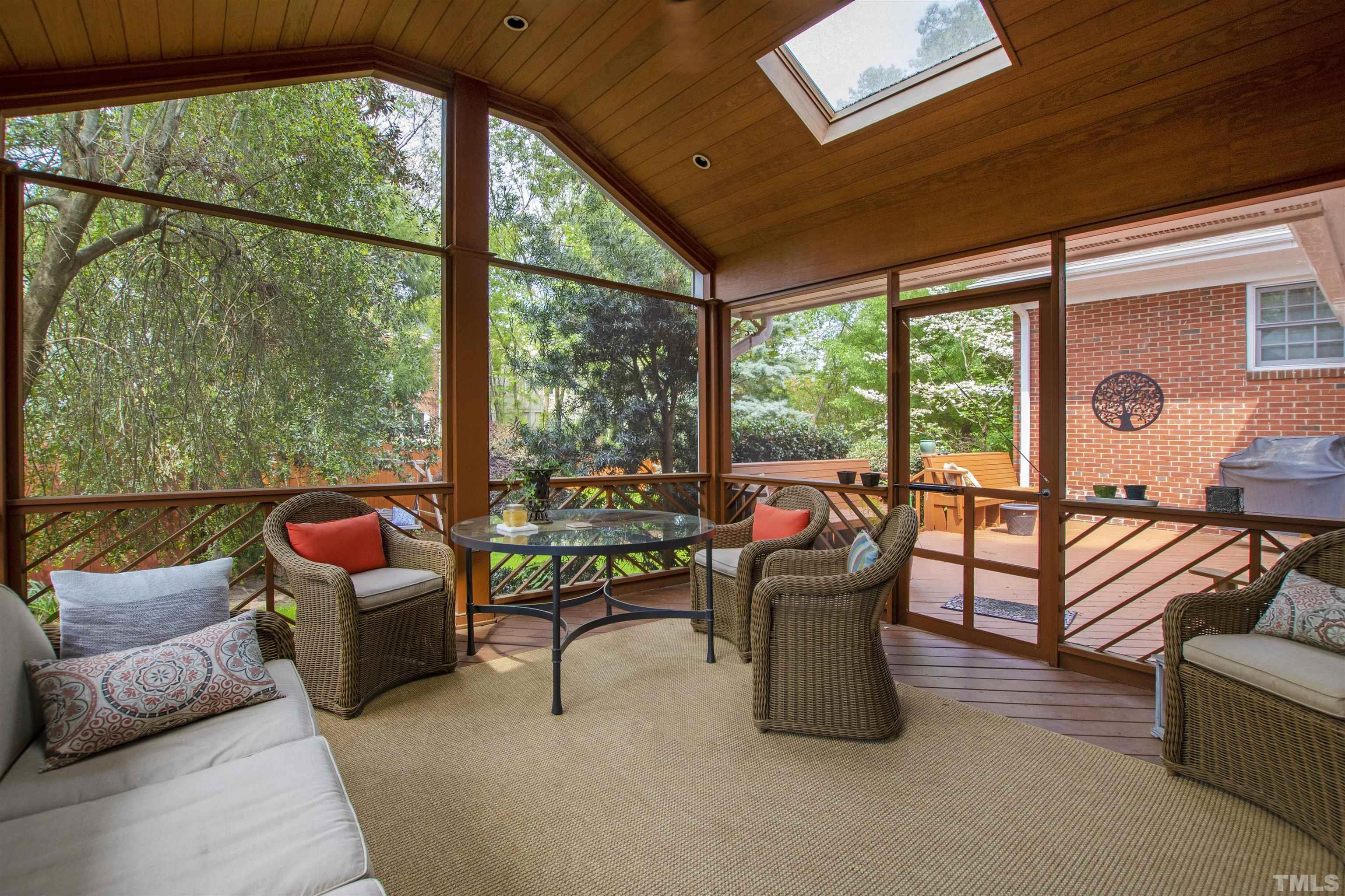 1320 Diehl Street Raleigh, NC 27608 - Photo 42 of 47 a living room with patio furniture and a floor to ceiling window