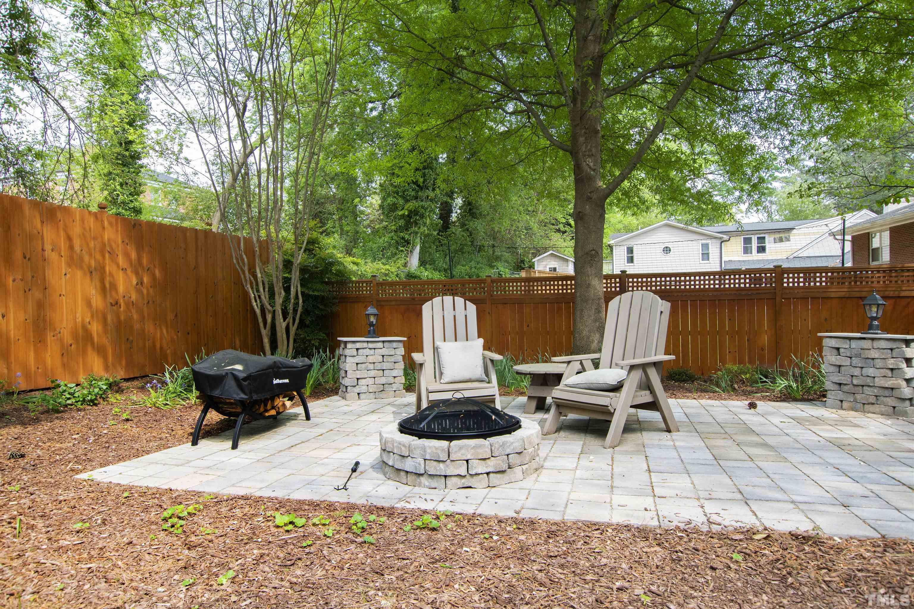 1320 Diehl Street Raleigh, NC 27608 - Photo 44 of 47 a view of a patio with a table and chairs