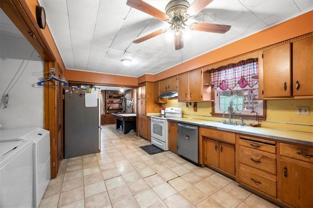 435 Dutch Ridge Road Beaver, PA 15009 - Photo 11 of 38 a large kitchen with a large window appliances and cabinets