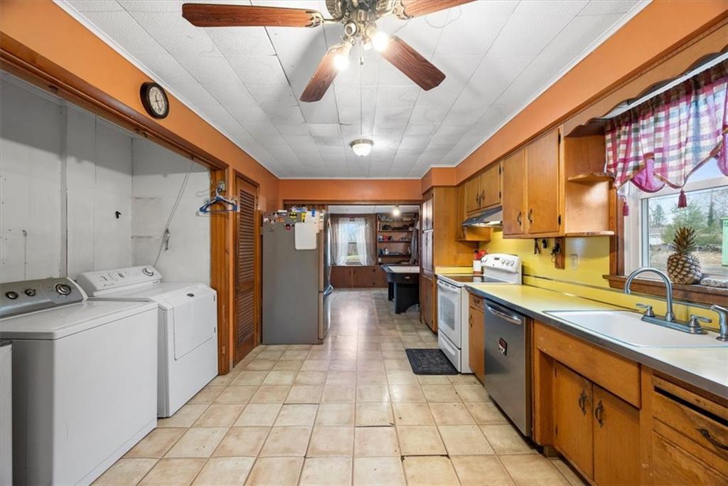 435 Dutch Ridge Road Beaver, PA 15009 - Photo 12 of 38 a large kitchen with a stove a sink dishwasher and a refrigerator