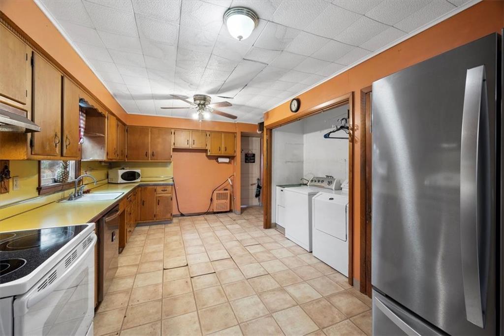 435 Dutch Ridge Road Beaver, PA 15009 - Photo 14 of 38 a kitchen with stainless steel appliances granite countertop a refrigerator a sink and dishwasher