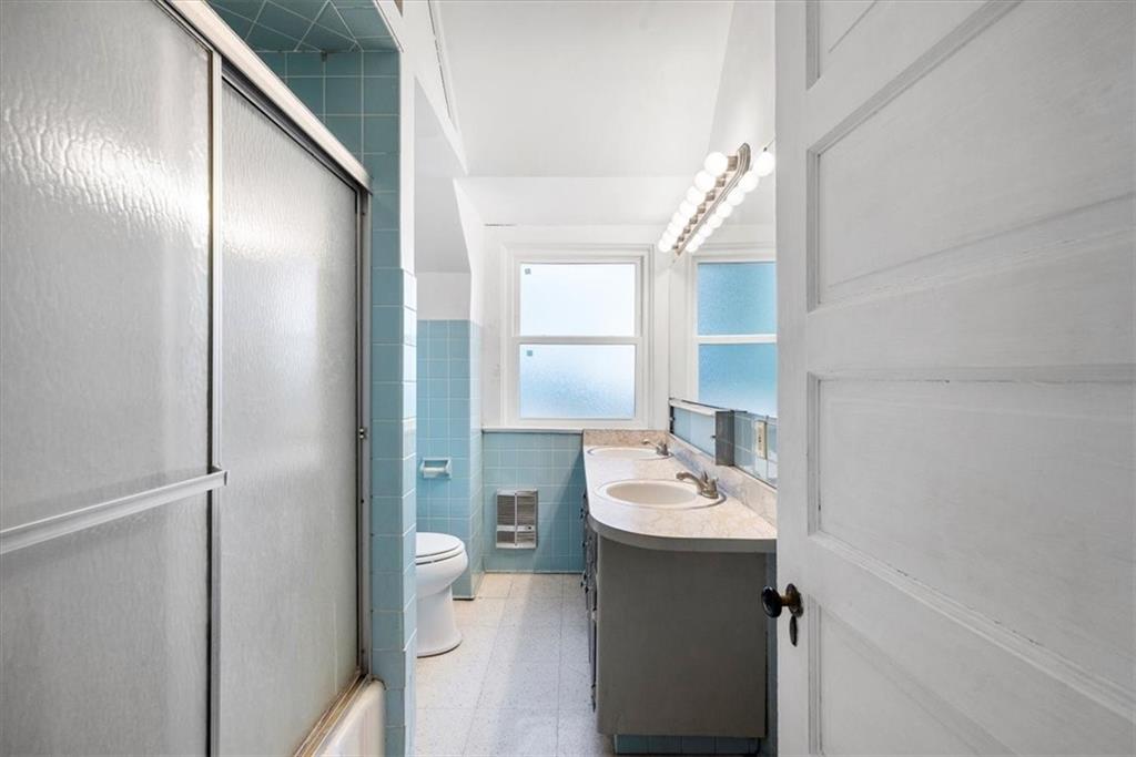 435 Dutch Ridge Road Beaver, PA 15009 - Photo 21 of 38 a bathroom with a sink a toilet and shower