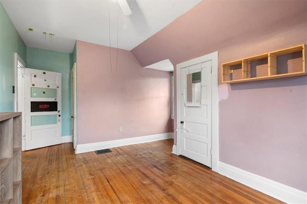 435 Dutch Ridge Road Beaver, PA 15009 - Photo 24 of 38 a view of an empty room with wooden floor and closet
