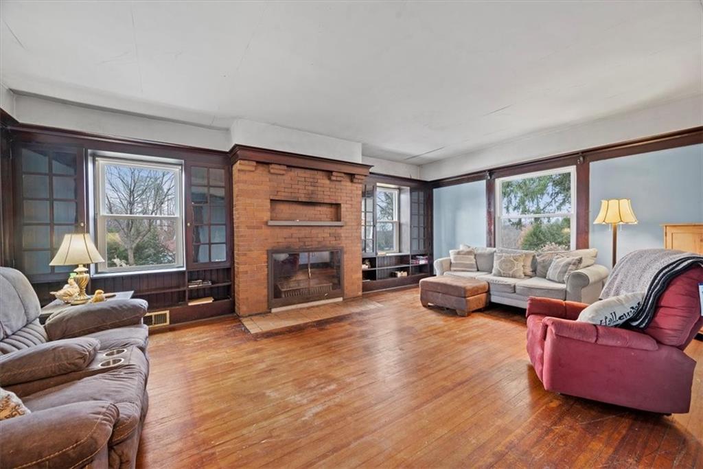 435 Dutch Ridge Road Beaver, PA 15009 - Photo 5 of 38 a living room with furniture large window and a fireplace