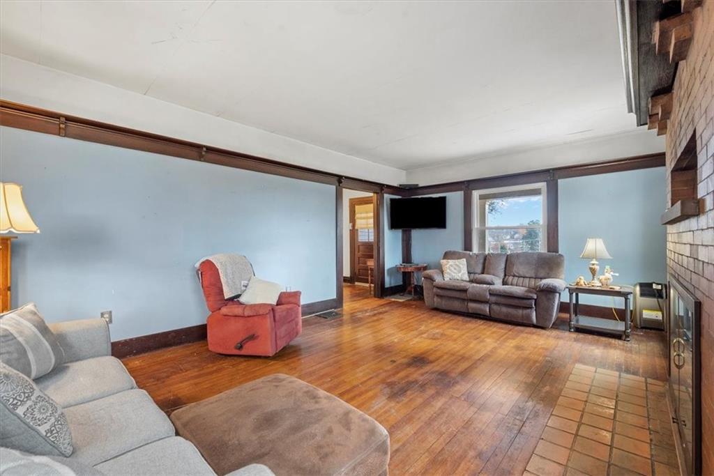 435 Dutch Ridge Road Beaver, PA 15009 - Photo 7 of 38 a living room with furniture and a couch
