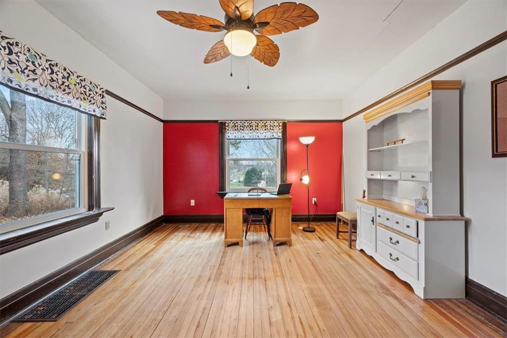 435 Dutch Ridge Road Beaver, PA 15009 - Photo 9 of 38 a living room with stainless steel appliances kitchen island granite countertop furniture a large window and wooden floor