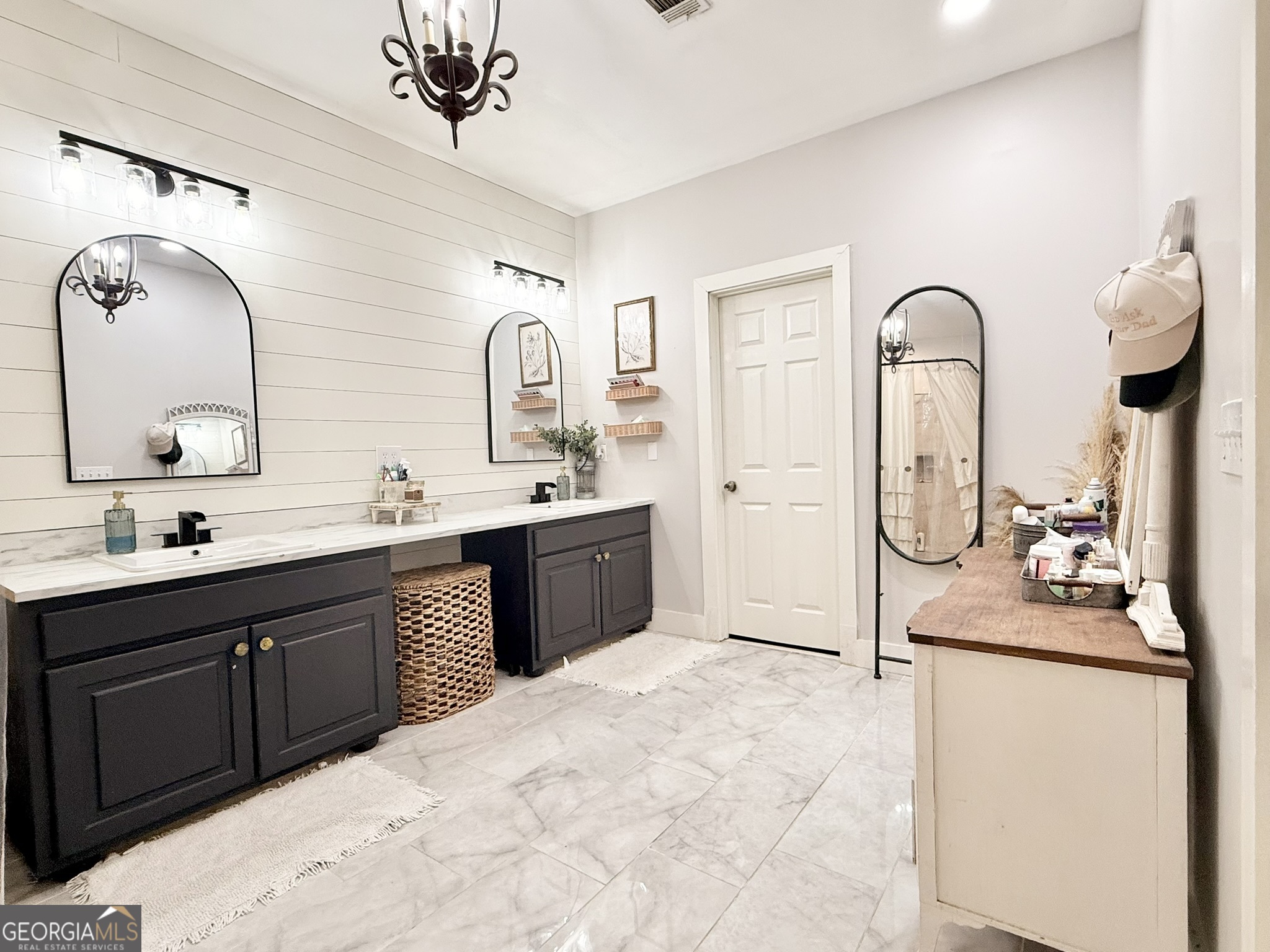 919 West Milner Road Concord, GA 30206 - Photo 27 of 40 a en suite bathroom with a double vanity sink and a mirror
