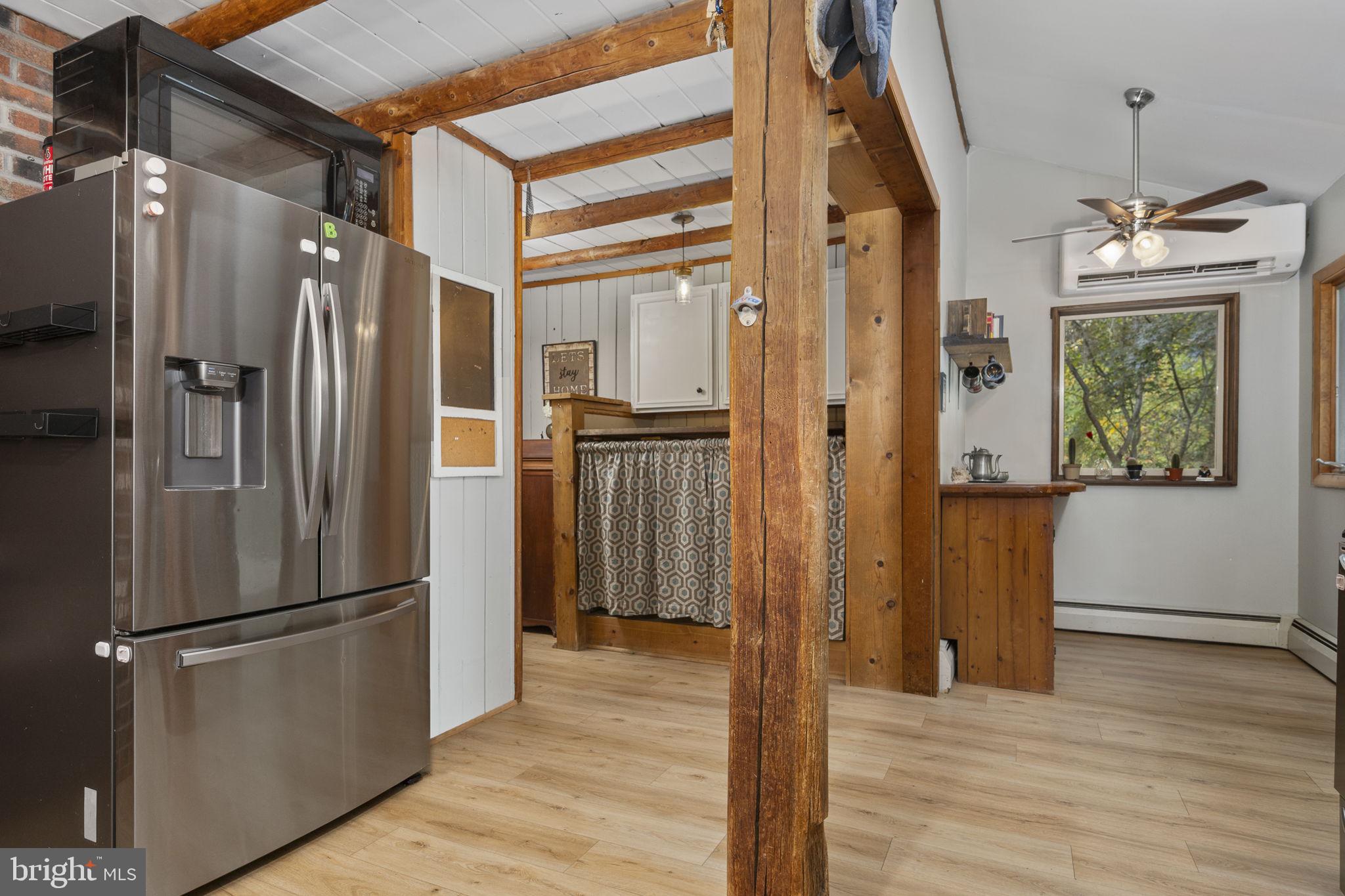 10 Woods Road Elverson, PA 19520 - Photo 25 of 49 a kitchen with stainless steel appliances a refrigerator and wooden floor