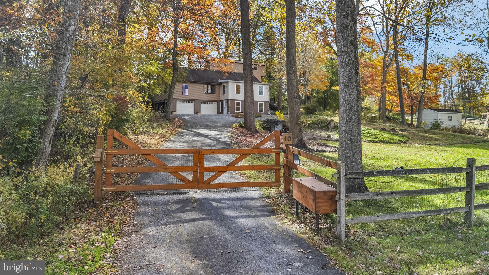 10 Woods Road Elverson, PA 19520 - Photo 3 of 49 a view of a bench in the garden