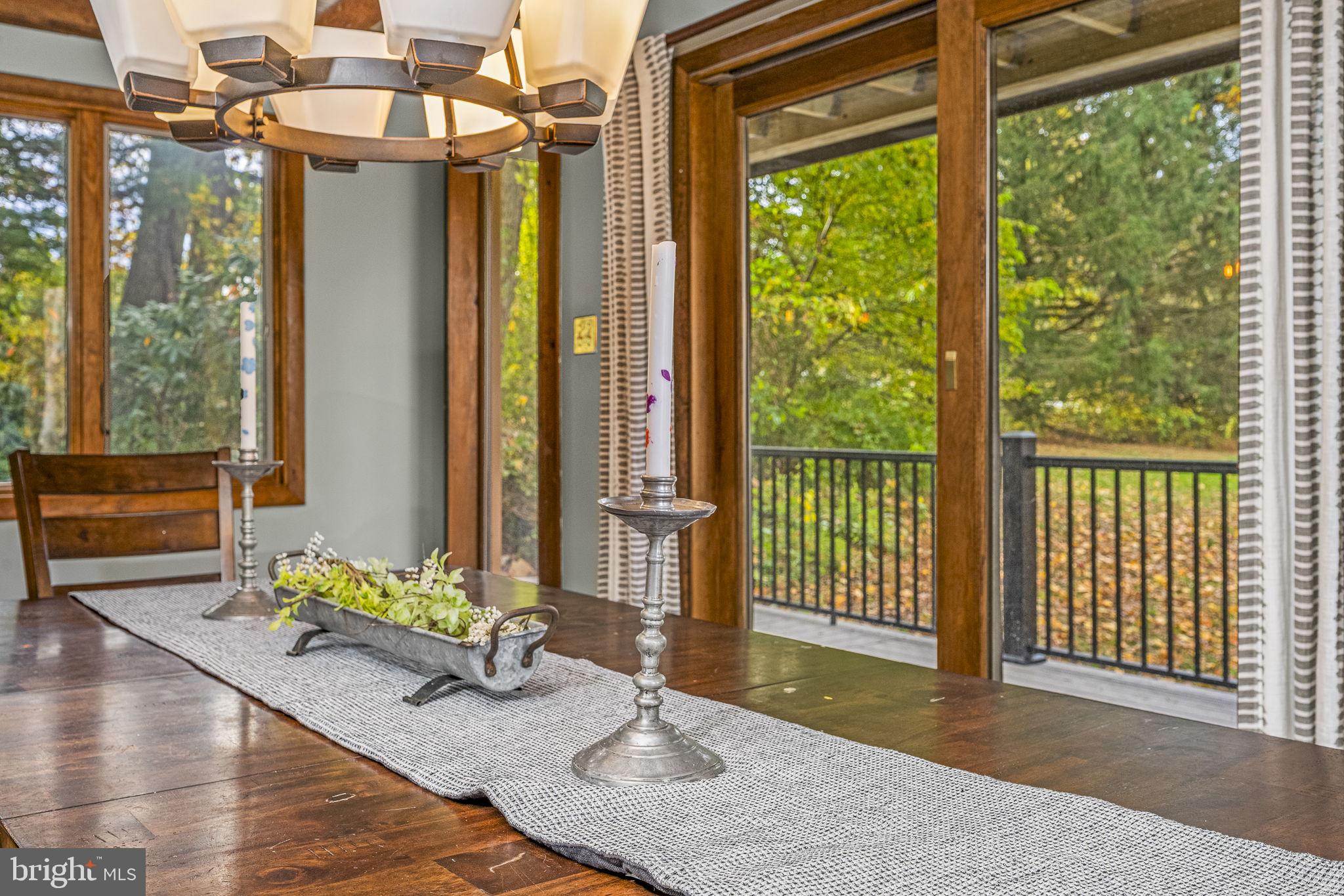 10 Woods Road Elverson, PA 19520 - Photo 32 of 49 a porch with a table and chairs