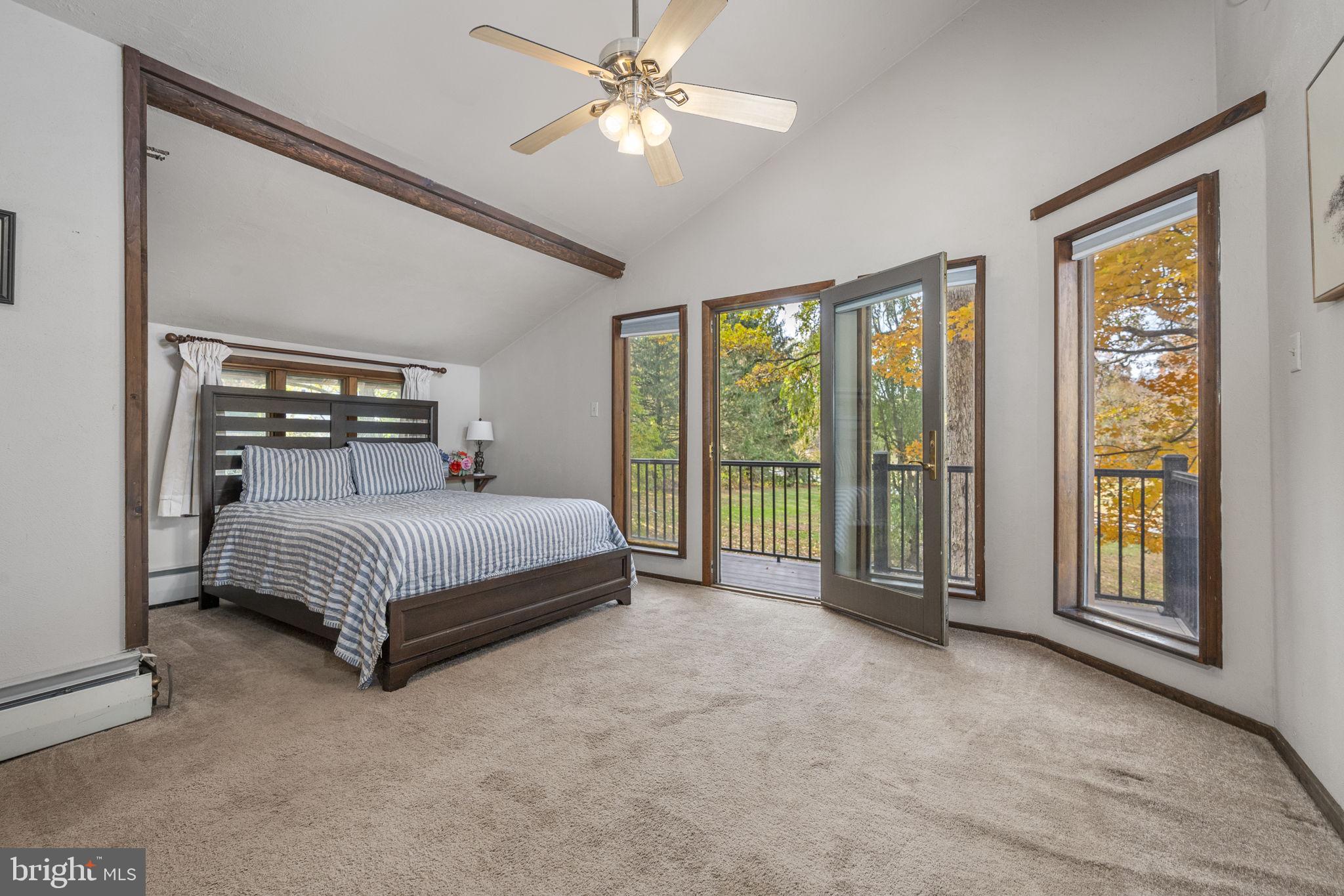 10 Woods Road Elverson, PA 19520 - Photo 42 of 49 a bedroom with a large bed and a large window