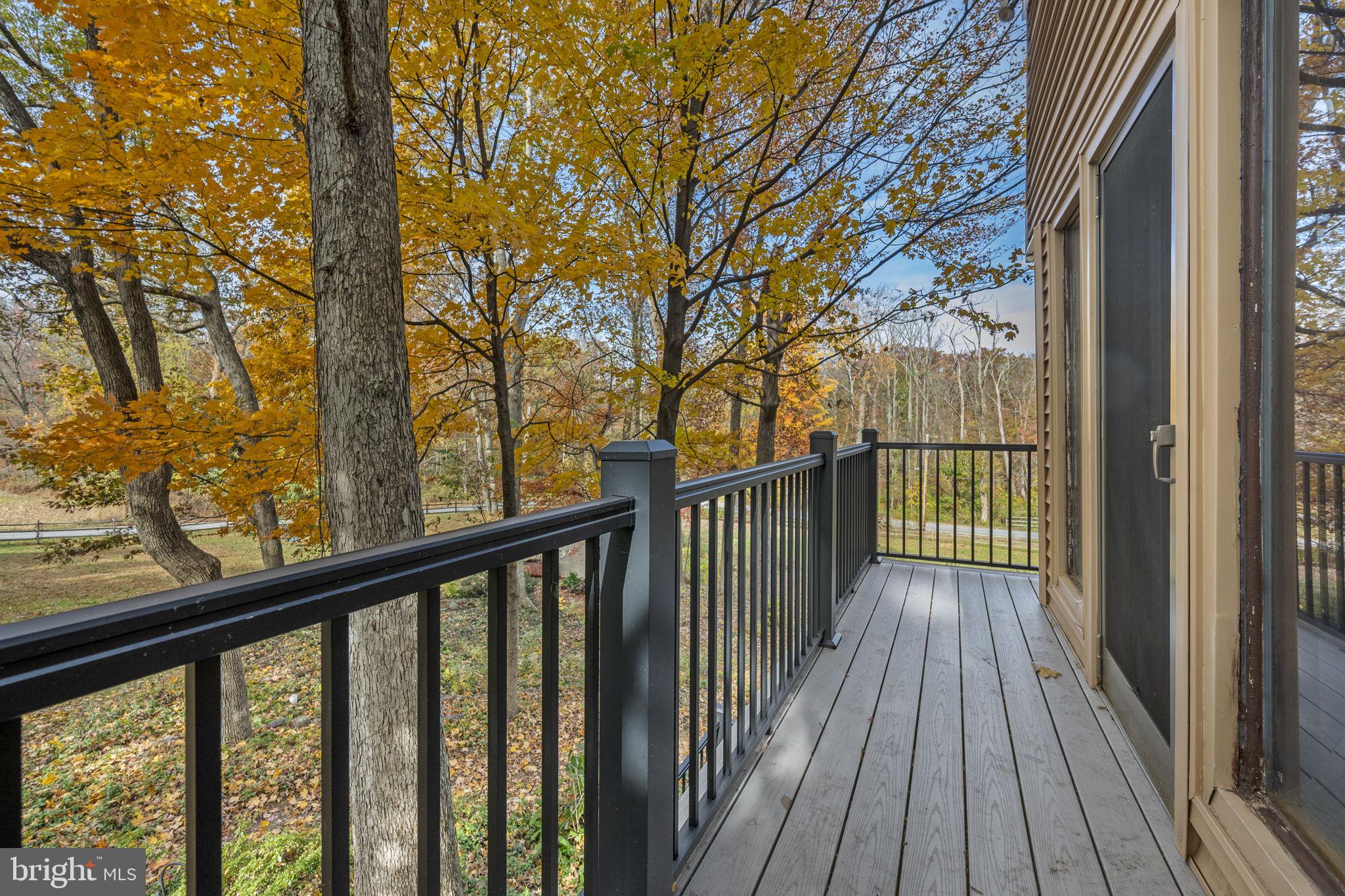 10 Woods Road Elverson, PA 19520 - Photo 43 of 49 a view of a balcony with wooden floor and fence