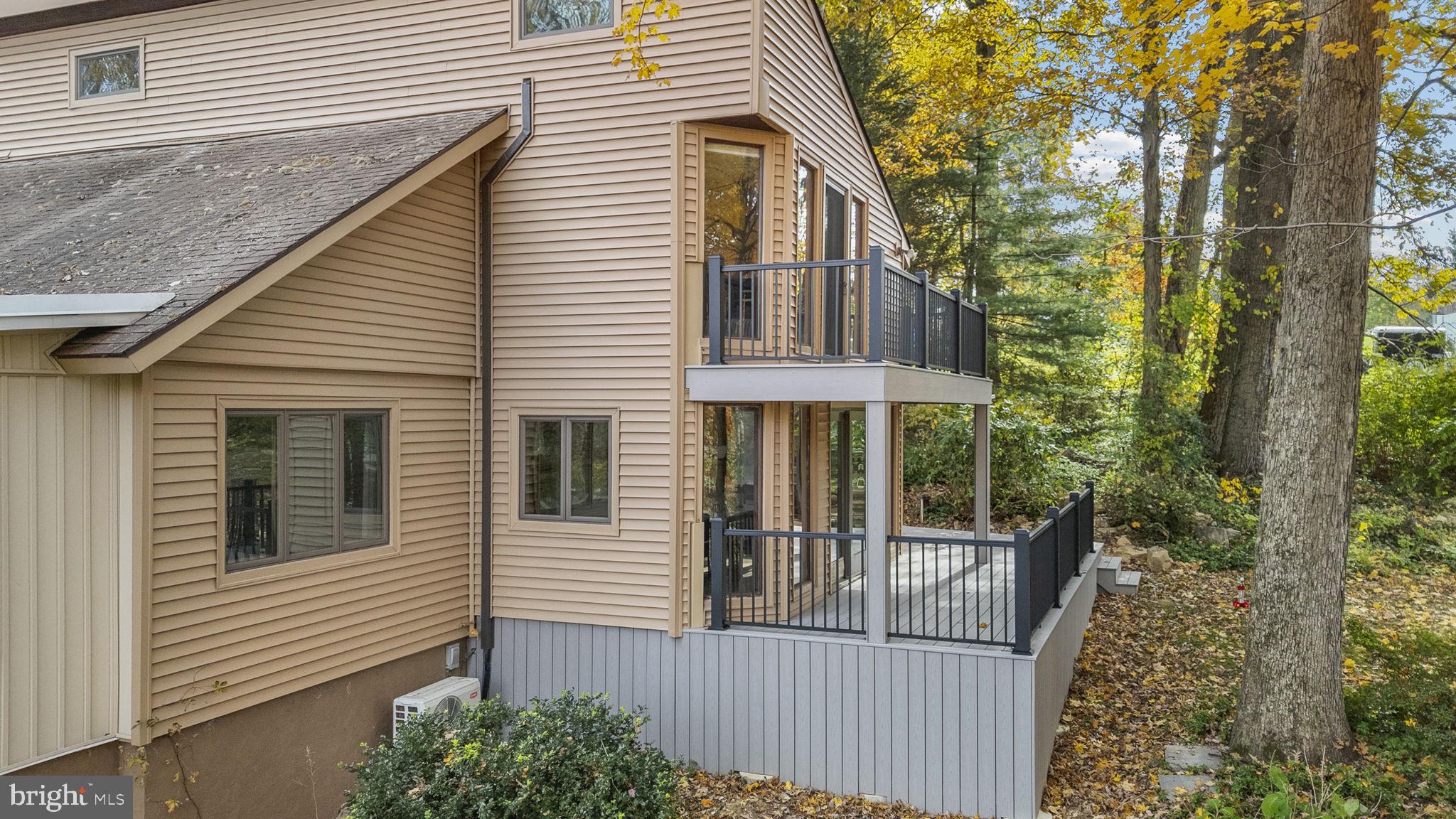 10 Woods Road Elverson, PA 19520 - Photo 6 of 49 a view of a house with a small deck and furniture