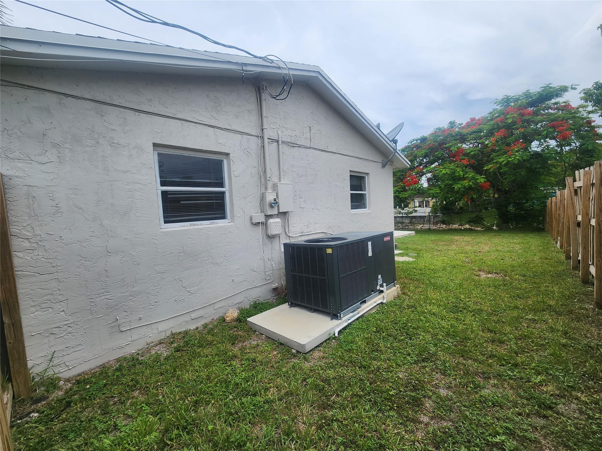 6133 Hogan Creek Road Margate, FL 33063 - Photo 3 of 5 a backyard of a house with seating space