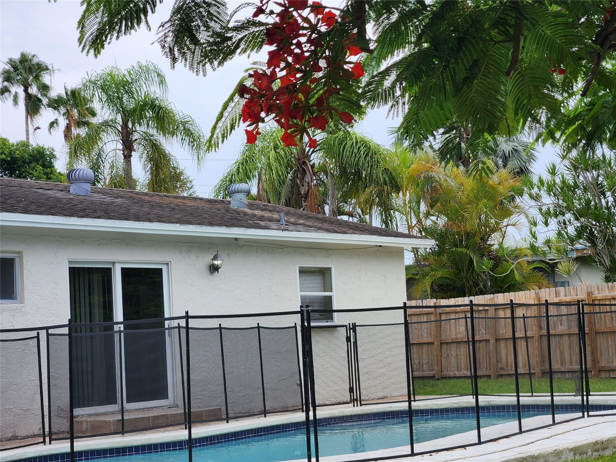 6133 Hogan Creek Road Margate, FL 33063 - Photo 4 of 5 a view of a house with a backyard