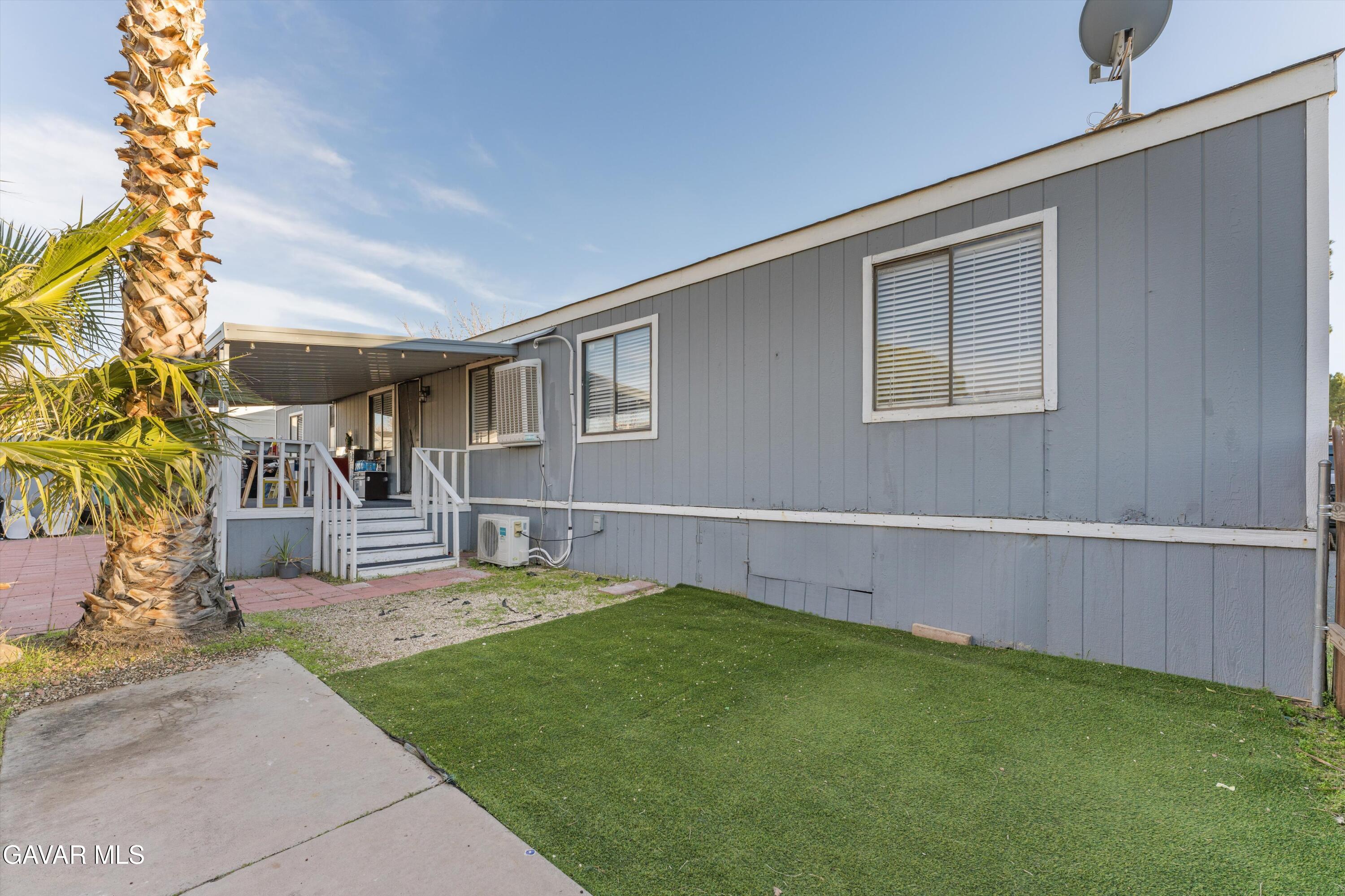 5711 Columbia Way Lancaster, CA 93536 - Photo 16 of 21 a view of a backyard with a garden and plants