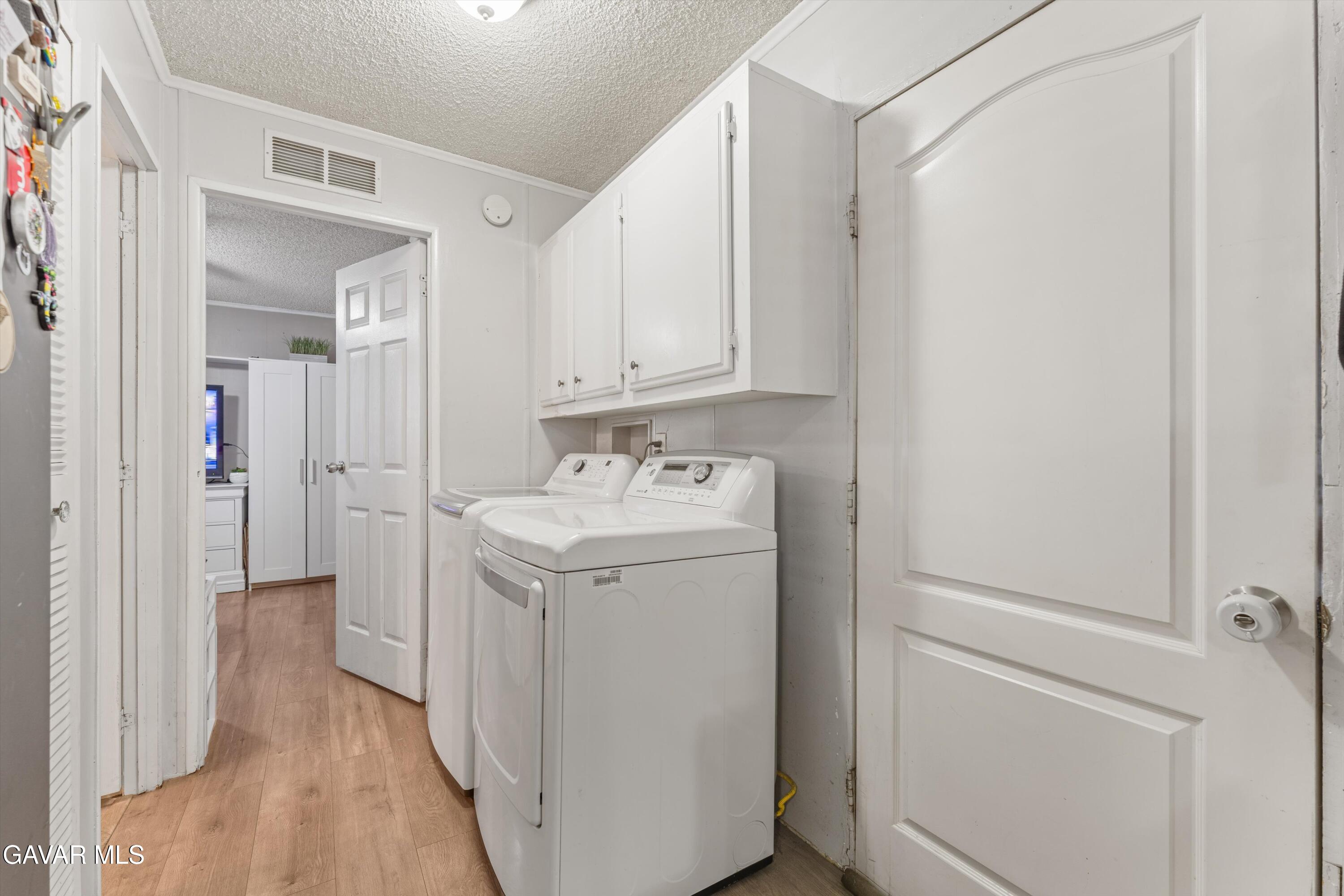 5711 Columbia Way Lancaster, CA 93536 - Photo 21 of 21 a bathroom with a sink and a mirror