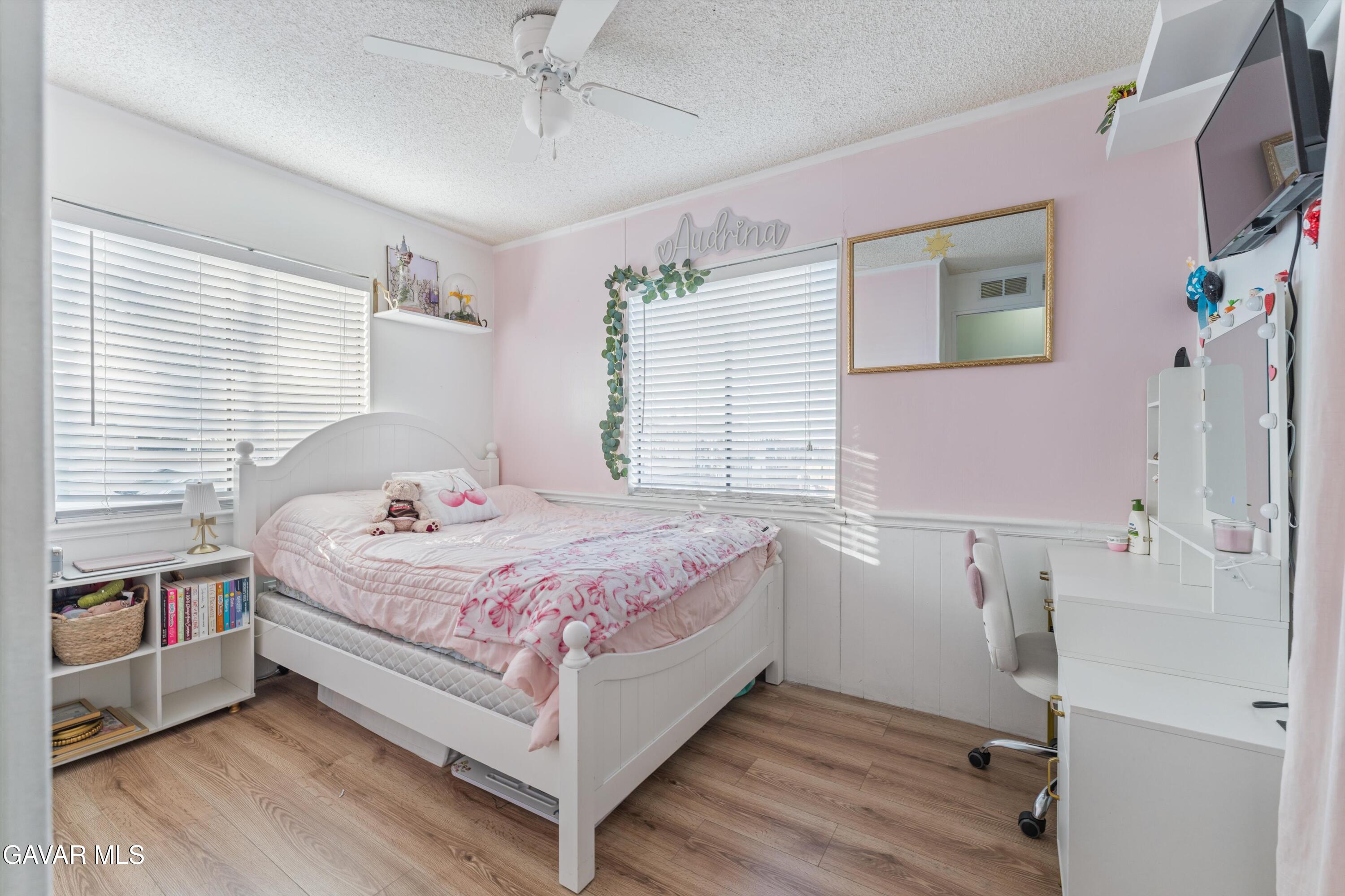 5711 Columbia Way Lancaster, CA 93536 - Photo 6 of 21 a bedroom with a bed and a window