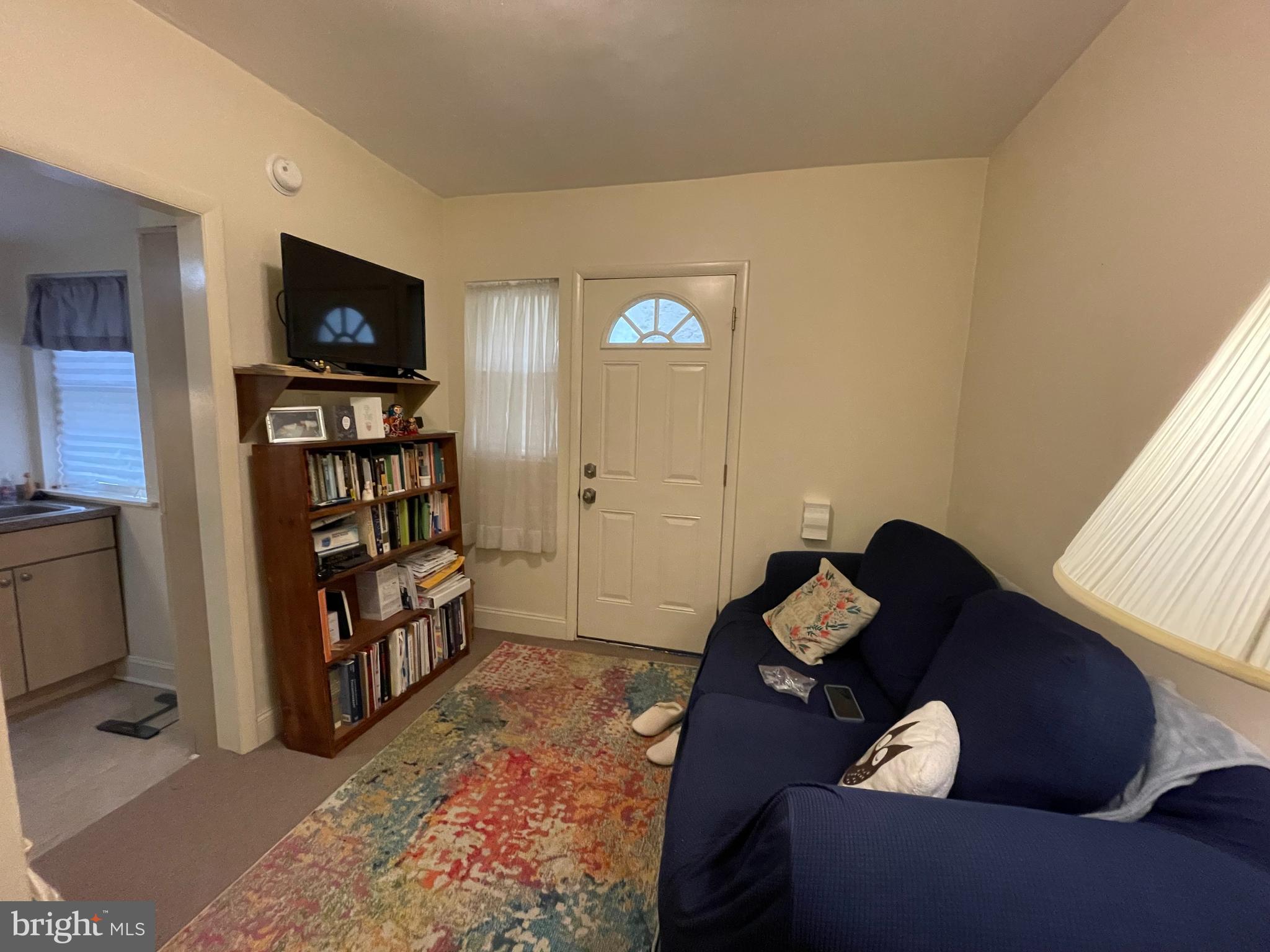 790 South Front Street, Unit R1 Philadelphia, PA 19147 - Photo 2 of 9 a living room with furniture and a flat screen tv