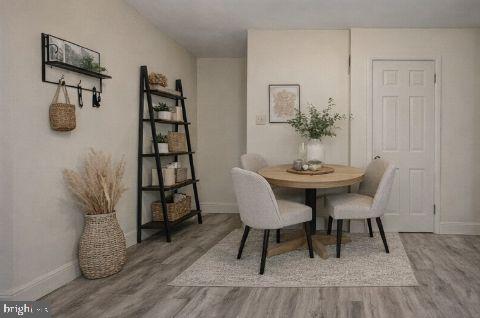 790 South Front Street, Unit R1 Philadelphia, PA 19147 - Photo 2 of 8 a view of a dining room with furniture and wooden floor