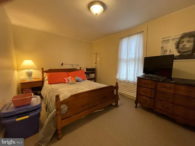 a bedroom with a bed and furniture