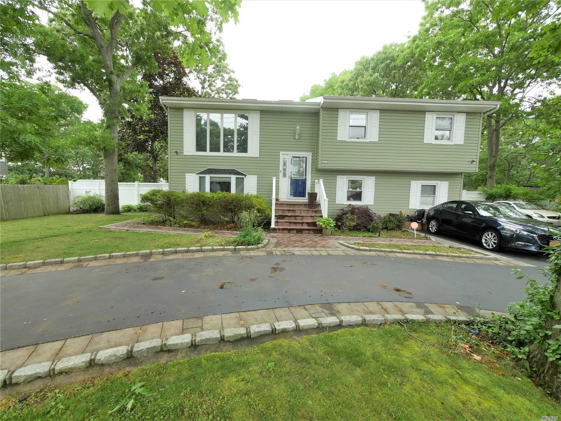627 Hawkins Road Selden, NY 11784 - Photo 1 of 1 front view of a house with a yard
