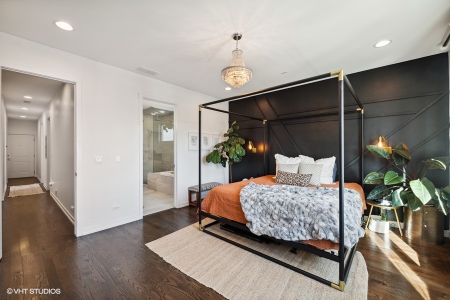 1033 South Racine Avenue, Unit 3NR Chicago, IL 60607 - Photo 11 of 34 a bedroom with a bed and wooden floor