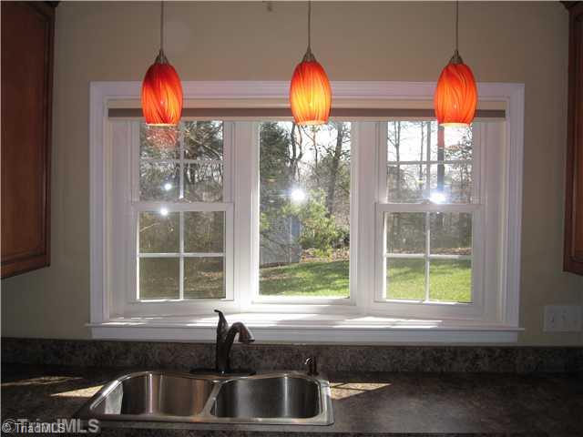 3220 Rockingham Road High Point, NC 27265 - Photo 4 of 16 Kitchen. Look out your new enegrgy efficient windows at the private backyard while doing dishes in your updated kitchen!