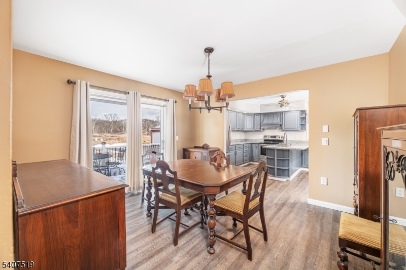 33 Hibler Road Newton, NJ 07860 - Photo 14 of 33 a dining room with furniture a chandelier and wooden floor