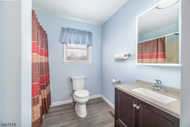 33 Hibler Road Newton, NJ 07860 - Photo 23 of 33 a bathroom with a toilet sink and mirror