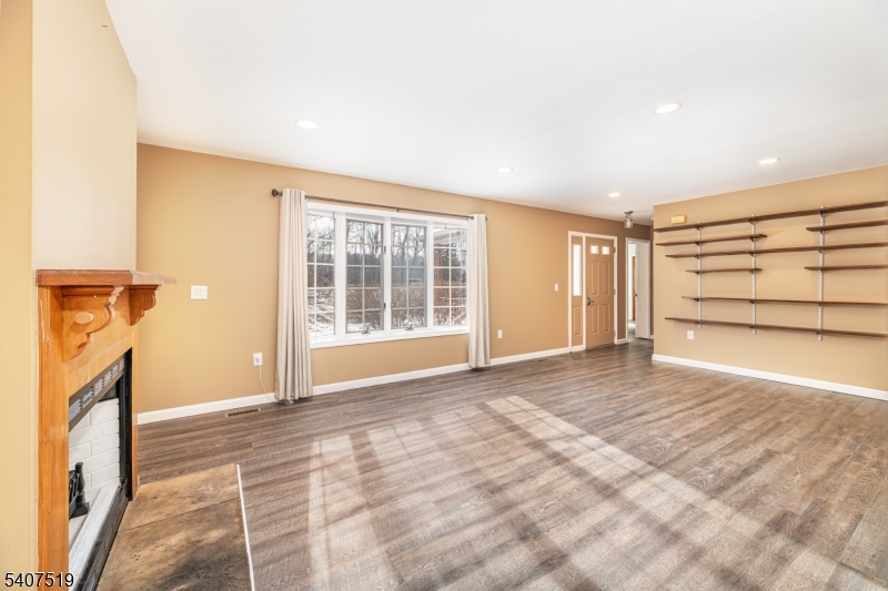 33 Hibler Road Newton, NJ 07860 - Photo 9 of 33 a view of an empty room with a fireplace and a window