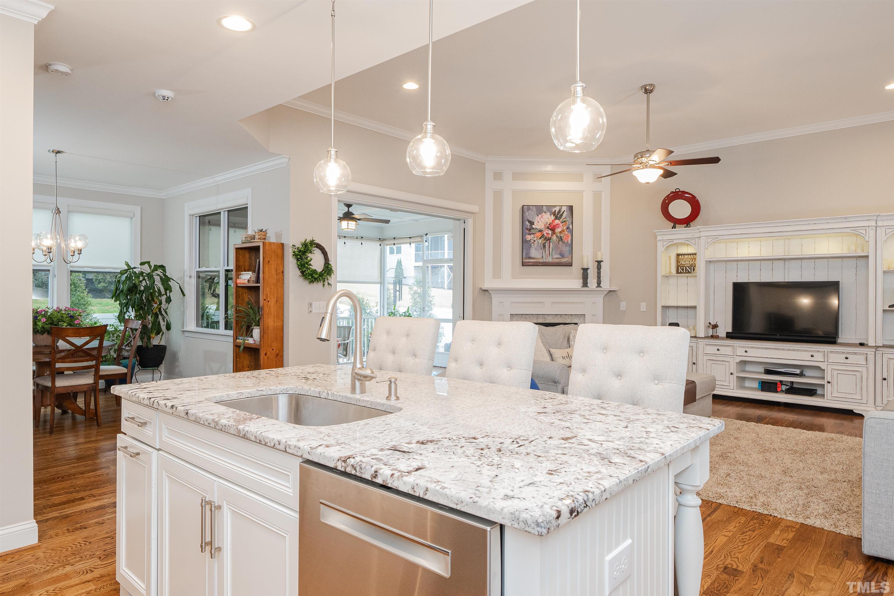 616 Connington Way Rolesville, NC 27571 - Photo 23 of 51 a kitchen with a sink a counter top space and living room view