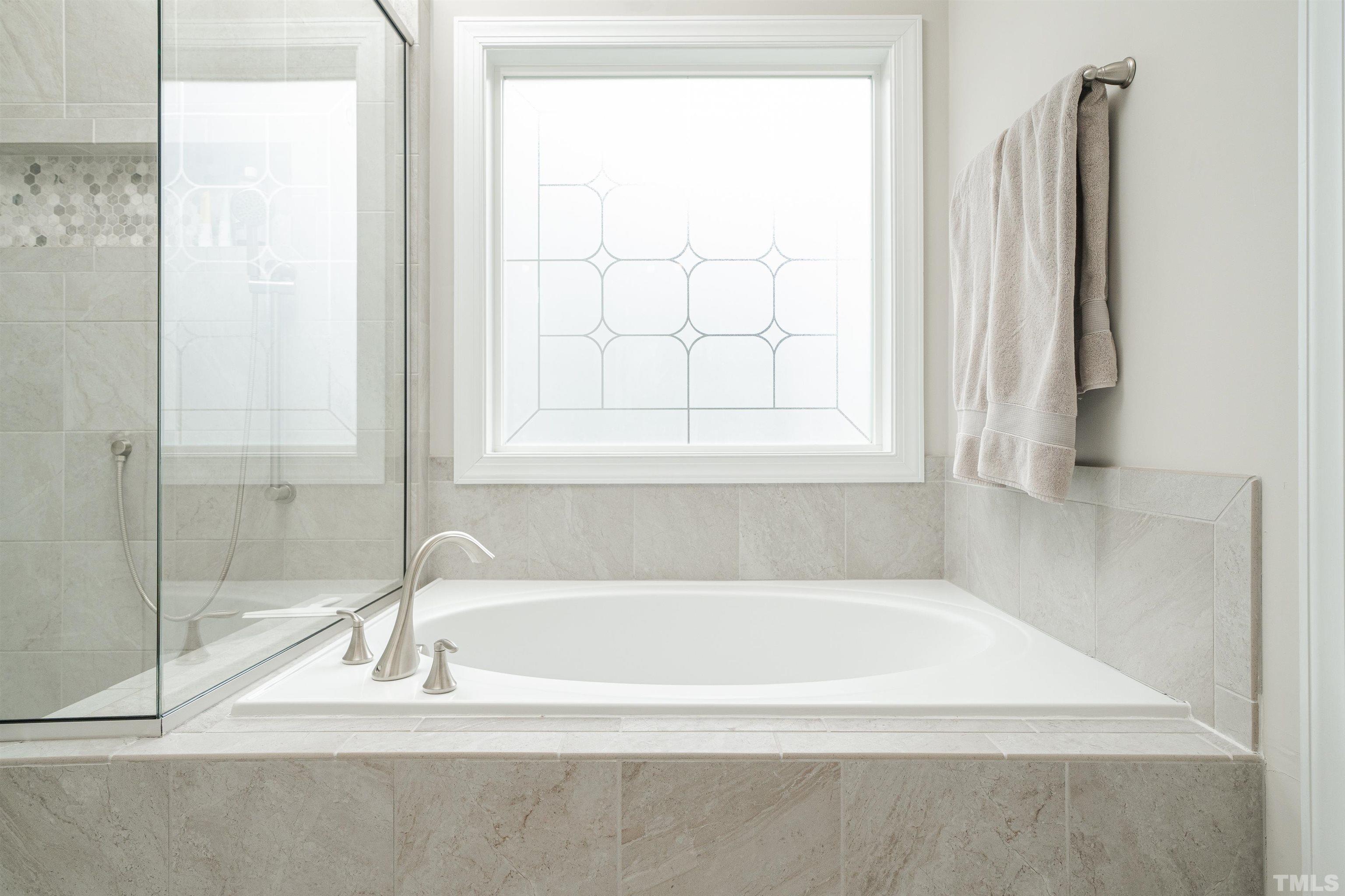 616 Connington Way Rolesville, NC 27571 - Photo 37 of 51 a white bath tub sitting next to a window