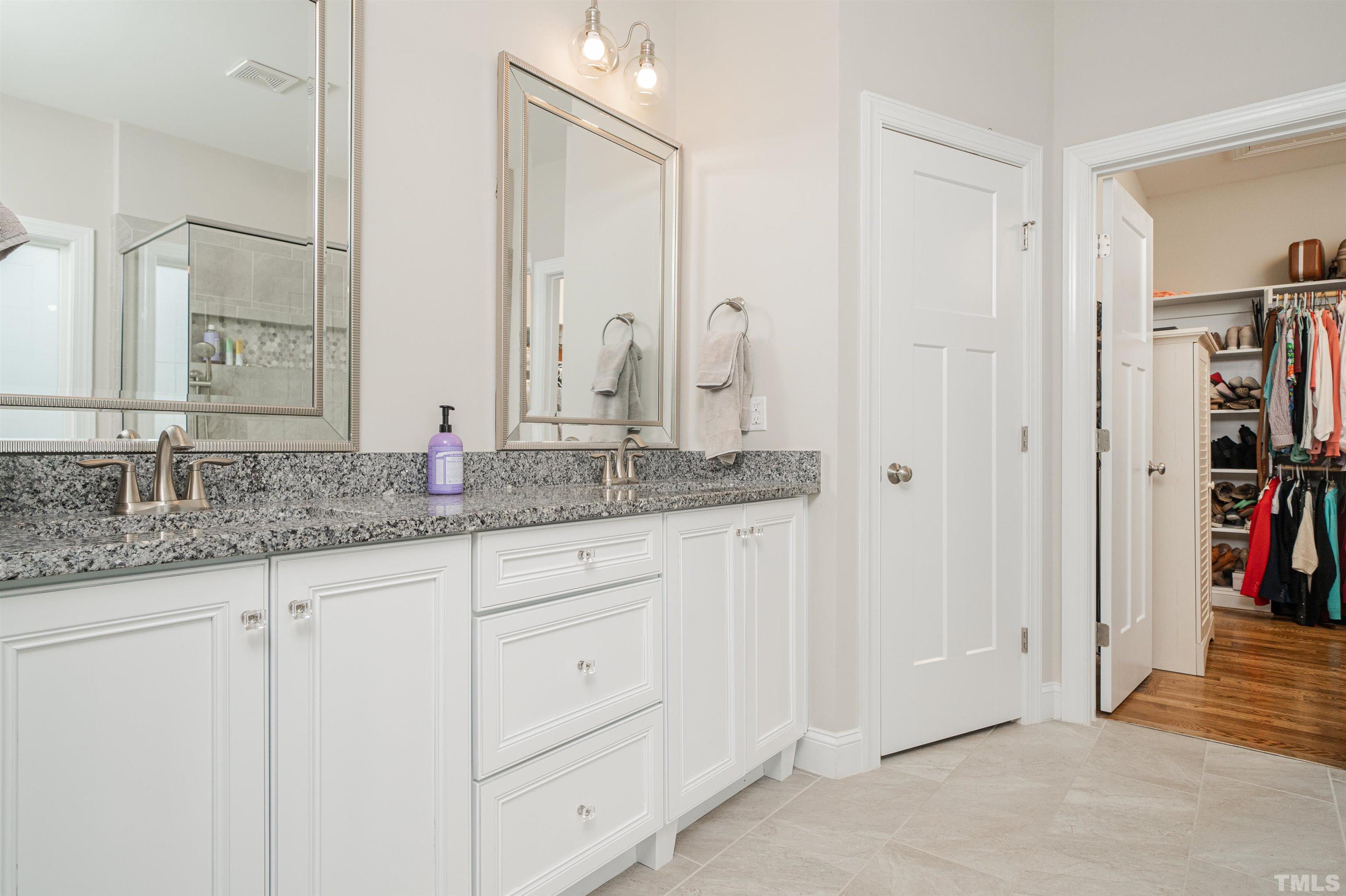 616 Connington Way Rolesville, NC 27571 - Photo 40 of 51 a bathroom with cabinets and a sink